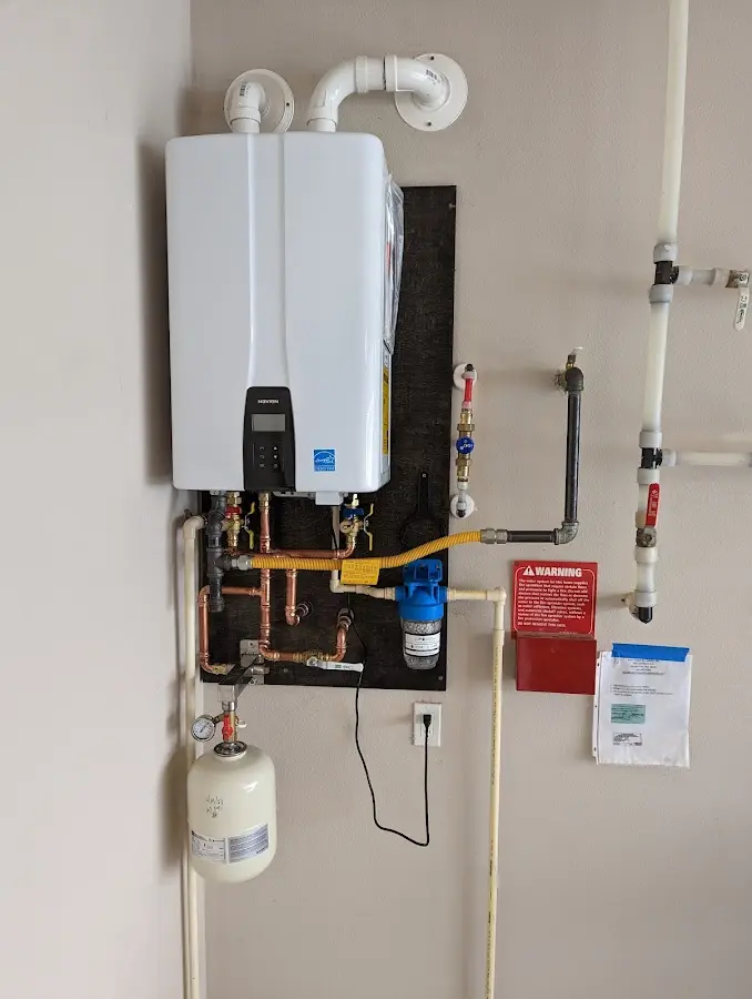 Professional plumber installing copper piping in a Sahuarita home